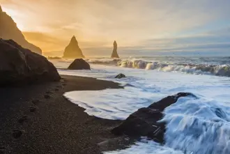 Reynisfjara And Sea Stacks At South Shore In Iceland.