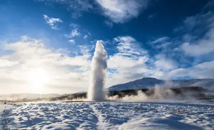 Strokkur geyser erupting in winter, Golden Circle Iceland