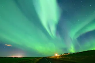 Northern Lights In Iceland Over Farm.