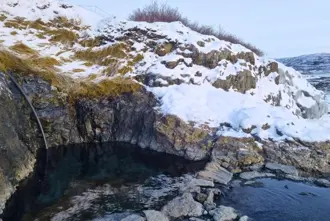 Hellulaug Hot Spring in winter in Iceland.