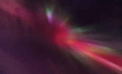 Red northern lights in a starry nights sky.