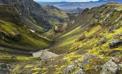 Þórsmörk's green moss-covered mountains and deep valleys in the Icelandic highlands.