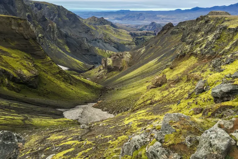 Þórsmörk's green moss-covered mountains and deep valleys in the Icelandic highlands.