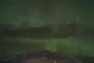 Fade Green Northern Light Over Aurora Igloo In Hella Iceland.
