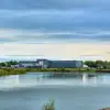 Exterior of Hotel Selfoss with riverside view.