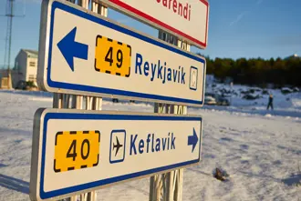 Road signs pointing to Reykjavik and Keflavik in Iceland during winter