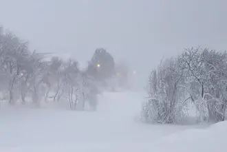 Akureyri during a snow storm in the winter and northern lights season.