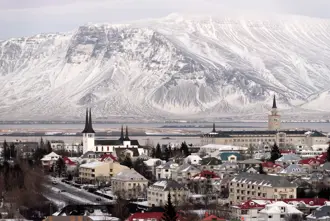 Winter view of Reykjavik with snow-covered mountains in the background