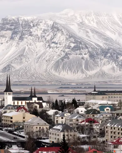 Winter view of Reykjavik with snow-covered mountains in the background