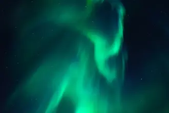 Northern lights in the night sky over Vik i Myrdal Iceland.