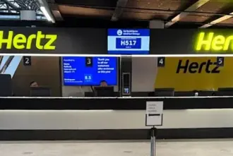 Hertz rental car company service counter at KEF airport in Iceland.