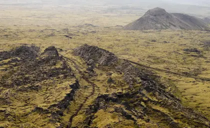 Expansive view of Eldvörp's volcanic terrain on the Reykjanes Peninsula, showcasing rugged lava fields and unique geological formations.