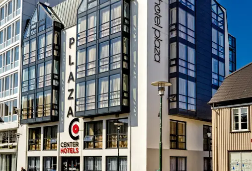 Iconic exterior of Center Hotels Plaza in Reykjavík, showcasing its modern glass facade and central location.