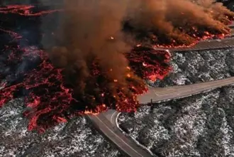Aerial view of the Blue Lagoon car park under hot lava that flows over it.