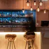The lobby at Hotel Vík í Mýrdal offers a bar seating area and cozy lighting.
