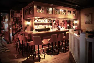 Lebowski Bar in Reykjavik, inspired by The Big Lebowski movie, with a warm, retro design and well-stocked bar.