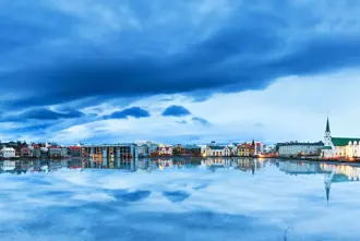 Tjornin Lake With View Of Reykjavik Church And Buildings Blue Sky Large