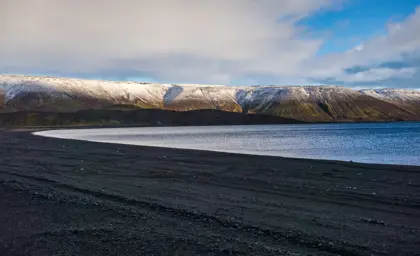 Lake Kleifarvatn with mountains in the far back.