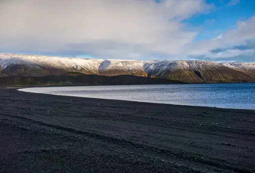 Lake Kleifarvatn with mountains in the far back.