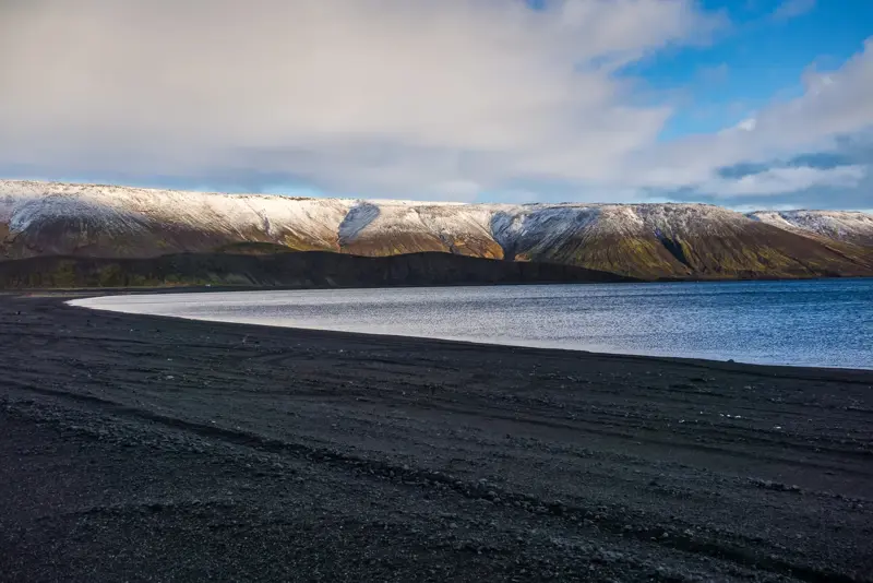 Lake Kleifarvatn with mountains in the far back.