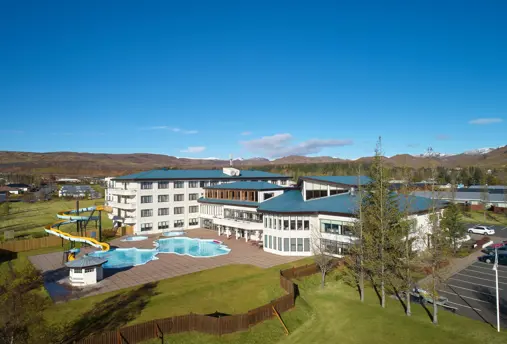 Aerial view of the grounds and outside pool of Hótel Örk.