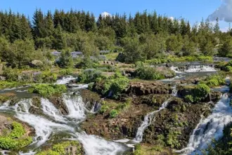 Ellidararadalur Valley In Reykjavik Waterfall Forest Area Under Blue Sky Large