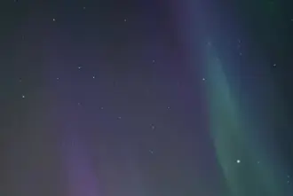 Colorful Aurora In Sky Over Hella Iceland.