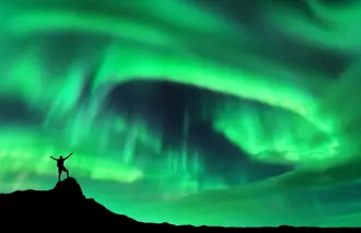 Travelreykjavik Northern Lights Silhouette Hiker Aurora Tour Iceland.Jpg Medium