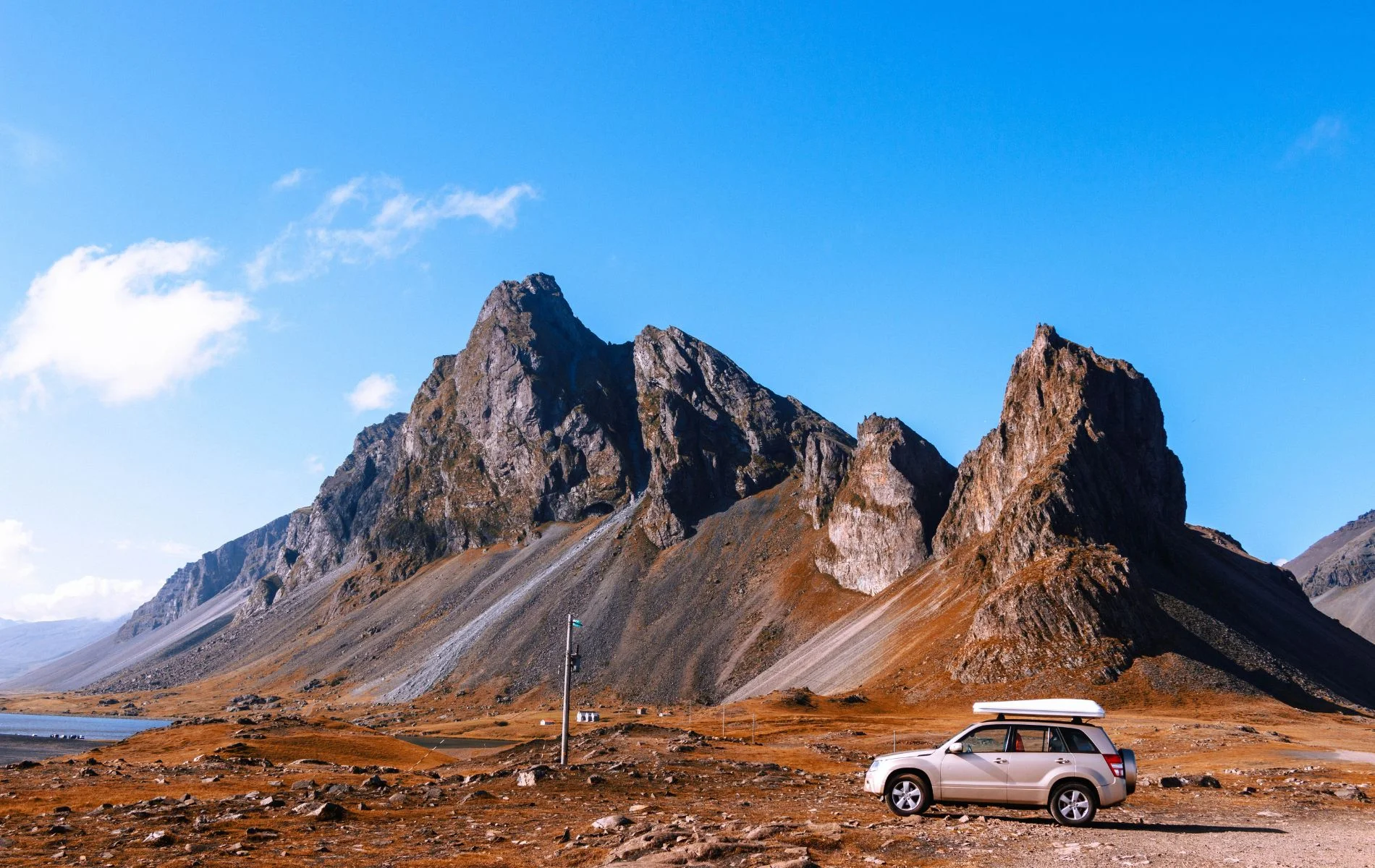 Iceland Stopover Car Under Mountain.