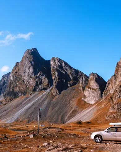 Iceland Stopover Car Under Mountain.