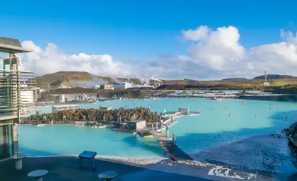 Geothermal Blue Lagoon spa with people enjoying the hot water in Iceland.