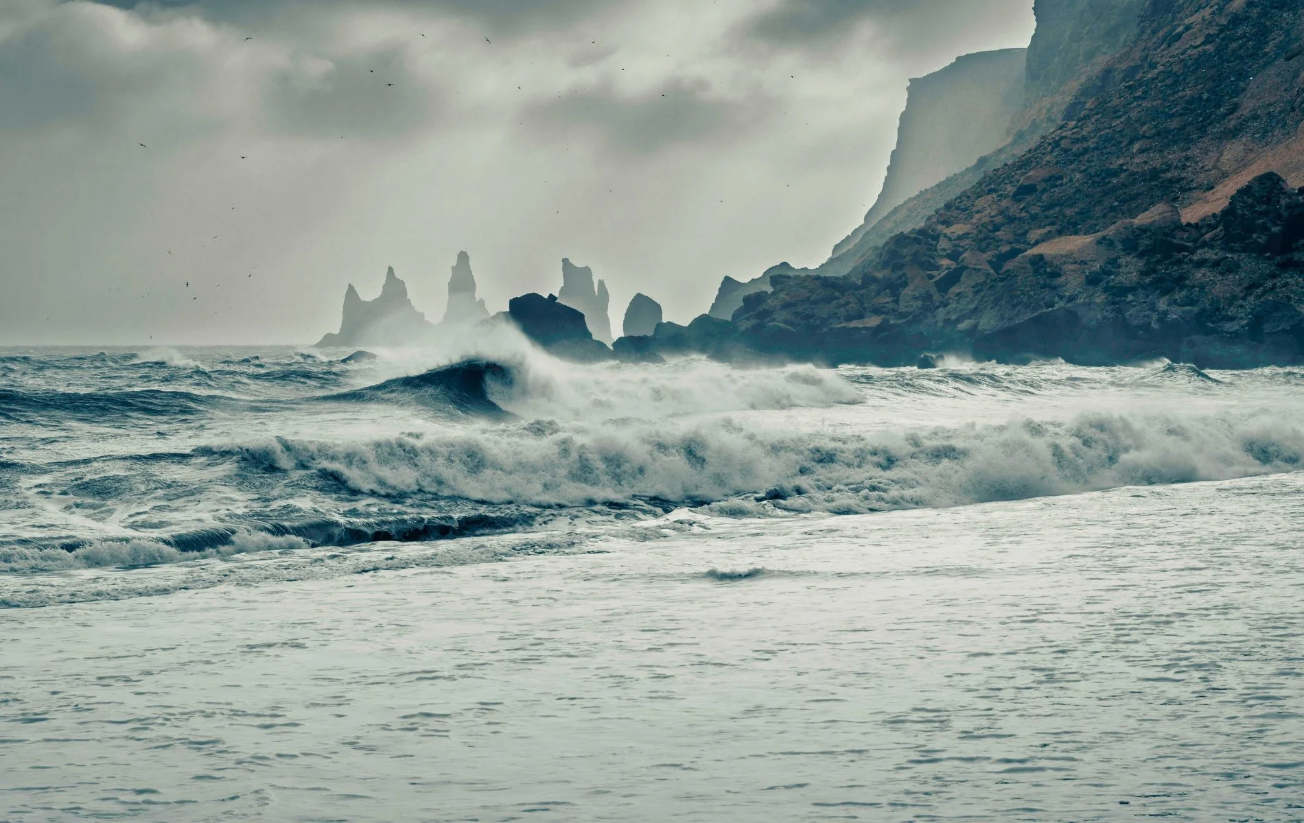 Reynisdrangar In Distance View From Vikurfjara Black Sand Beach Vik Iceland.
