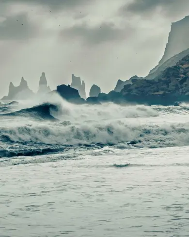 Reynisdrangar In Distance View From Vikurfjara Black Sand Beach Vik Iceland.