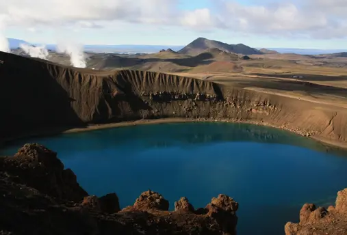 Krafla Volcano and Víti Crater with blue water.
